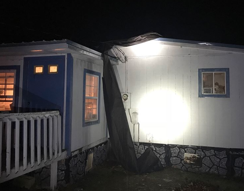 This photo posted by the Pulaski County sheriff's office shows a home damaged by strong storms on Monday night.