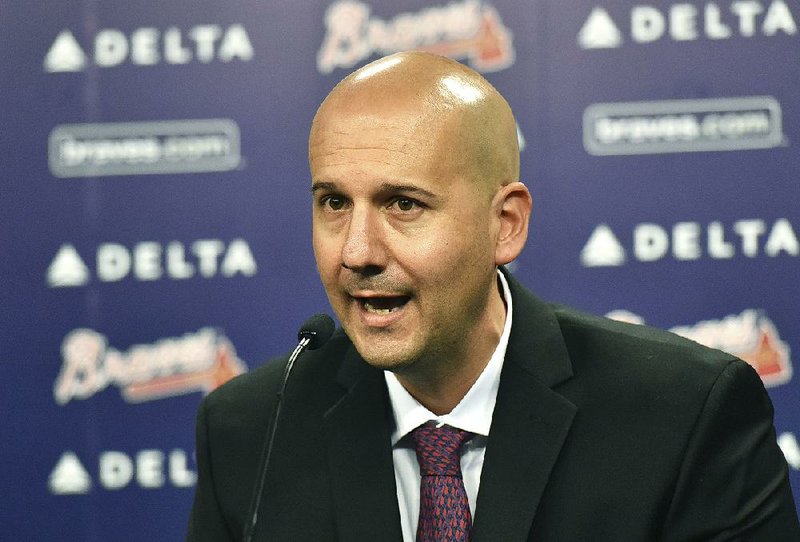  In this Oct. 1, 2015, file photo, Atlanta Braves general manager John Coppolella speaks during a news conference at Turner Field in Atlanta. The former Braves general manager apologized Tuesday, Dec. 5, 2017, for rules violations that led to him being banned from baseball for life, saying he's "disgraced and humbled" by his actions.