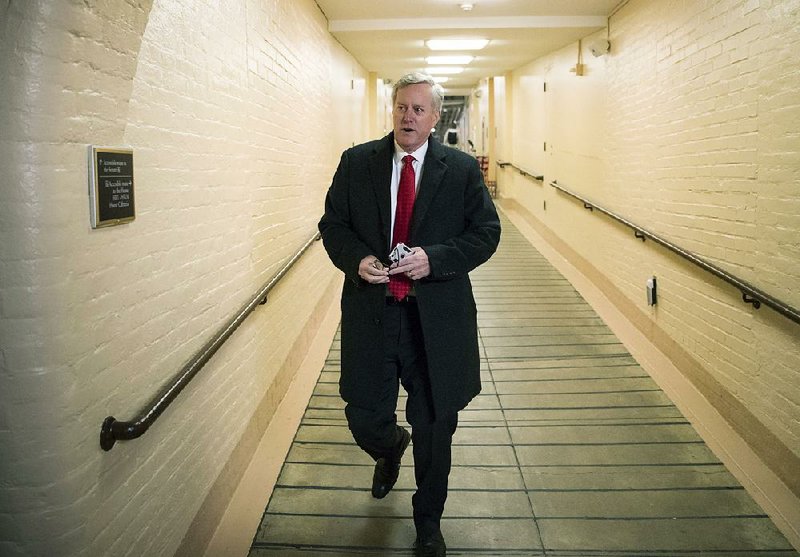 Rep. Mark Meadows, R-N.C., head of the hard-right Freedom Caucus, arrives Tuesday for a closed strategy session on the budget with House Speaker Paul Ryan. 
