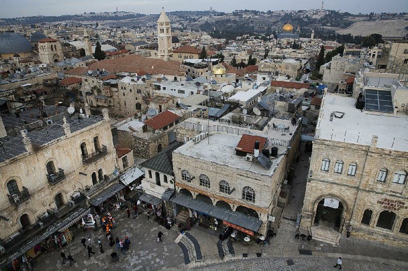 People walk through Jerusalem’s Old City area Tuesday. President Donald Trump will publicly address his plan on Jerusalem today after telling the leaders of the Palestinian Authority and Jordan in phone calls that he intends to move the U.S. Embassy in Israel from Tel Aviv to Jerusalem. 
