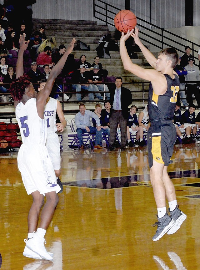 MARK HUMPHREY ENTERPRISE-LEADER/Prairie Grove junior Will Pridmore launches a 3-point shot against Elkins' Chad Graham. Pridmore made three shots from 3-point land and scored 11 points, but Elkins beat the Tigers, 45-38, Friday.