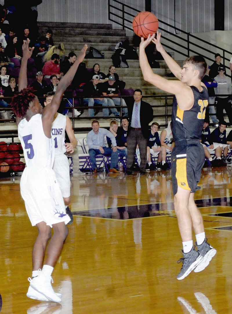 MARK HUMPHREY ENTERPRISE-LEADER/Prairie Grove junior Will Pridmore launches a 3-point shot against Elkins' Chad Graham. Pridmore made three shots from 3-point land and scored 11 points, but Elkins beat the Tigers, 45-38, Friday.