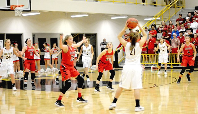 MARK HUMPHREY ENTERPRISE-LEADER Farmington sophomore Makenna Vanzant (No. 22) returned to action during the Lady Cardinals' rivalry girls basketball game at Prairie Grove Nov. 27. Vanzant recently spent 16 days in Arkansas Children's Hospital at Little Rock battling a life-threatening illness, yet has recovered miraculously. She was back for Farmington's season-opener and helped the Lady Cardinals win big, 50-22.