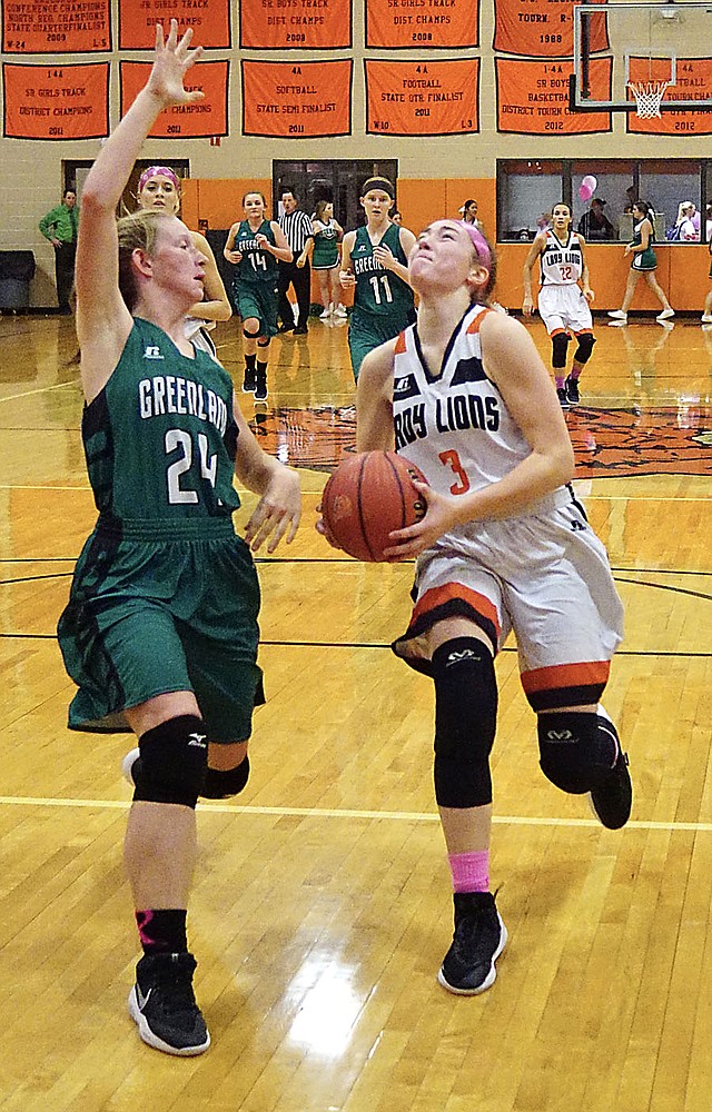 NWA DEMOCRAT-GAZETTE/Randy Moll Gravette senior Kyrstin Branscum gets past Fiona Wilson of Greenland for a shot during play between the two teams in Lion Fieldhouse on Tuesday, Nov. 28, 2017.