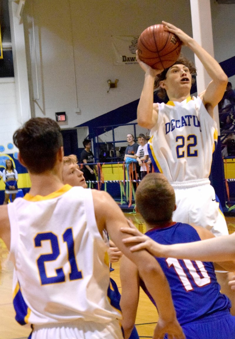 MIKE ECKELS/Westside Eagle Observer Garry Woods (Decatur 22) went for a long jump shot during the fifth annual Decatur Holiday Hoops Classic Tournament Nov. 28 at Peterson Gym in Decatur.