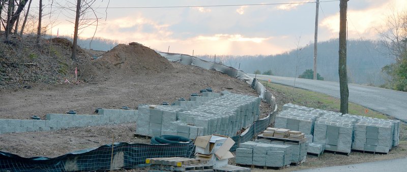 Keith Bryant/The Weekly Vista A retaining wall is under construction near the Blowing Springs trailhead for the Razorback Greenway spur that will connect the park to the extended greenway trail network. The extension project is expected to be completed in 2018.