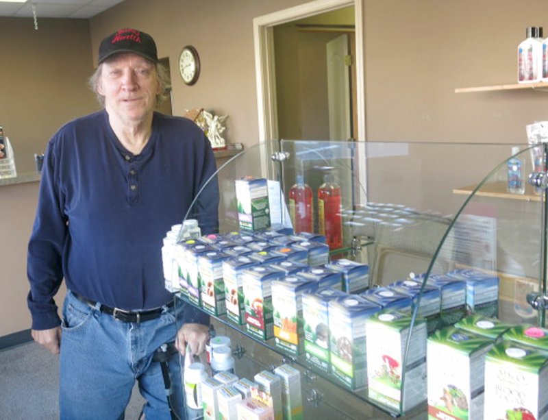 Photo by Susan Holland Bob Boling, owner and operator of the Jabez Health store, shows several of the products he offers for sale in his shop at its new location. In the foreground are several in the extensive line of Host Defense mushroom supplements he carries. Business hours for Jabez Health, at 125 Main Street S.E. in Gravette, are 9 a.m. to 5 p.m. Monday through Saturday.
