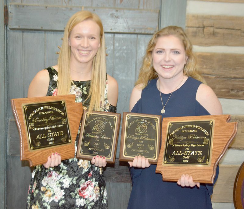Graham Thomas/Herald-Leader Siloam Springs senior Brinkley Beever, left, and junior Kaitlyn Robinson earned All-Conference and All-State honors for the 2017 golf season. The team held its award banquet Sunday at the Butterfield Cabin in West Siloam Springs, Okla.