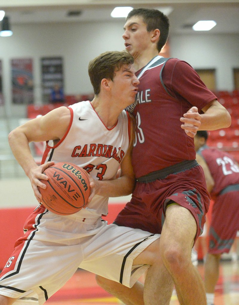 NWA Democrat-Gazette/ANDY SHUPE Farmington's Jacob Gray (left) and Springdale's Carl Fitch collide Tuesday during the first half in Cardinal Arena in Farmington. Visit nwadg.com/photos to see more photographs from the game.