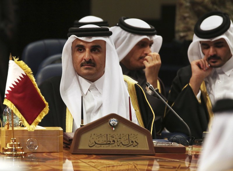 Qatar's emir, Sheikh Tamim bin Hamad Al Thani, attends the Gulf Cooperation Council summit in Kuwait City, Tuesday, Dec. 5, 2017. Kuwait hosted a meeting Tuesday of the Gulf Cooperation Council that saw Qatar's ruling emir attend, but other rulers stayed away amid the ongoing boycott targeting Doha. (AP Photo/Jon Gambrell)