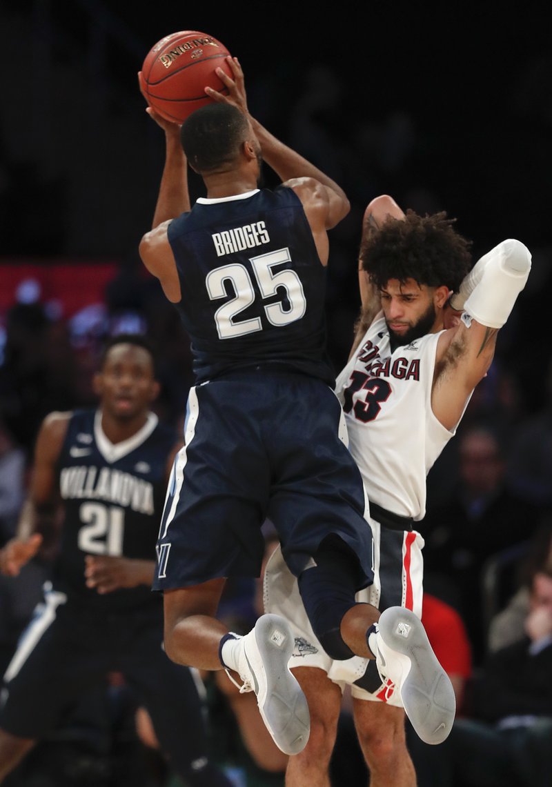 The Associated Press STAND-OUT JUNIOR: Villanova guard Mikal Bridges (25) puts up a shot against Gonzaga guard Zach Norvell Jr. (23) during the first half of an NCAA basketball game Tuesday in New York.