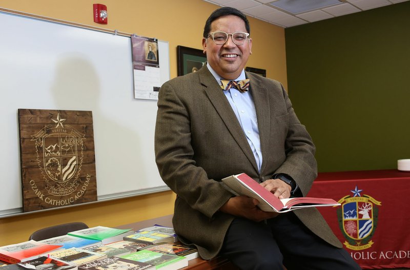 John Rocha, Ozark Catholic Academy's head of school, sits in a classroom Nov. 17 on the campus of the school at the Religious Education Center at St. Joseph Catholic Church in Tontitown. The academy is the area's first Catholic high school and is preparing to open next fall. The academy signed a five-year lease for use of the education center.