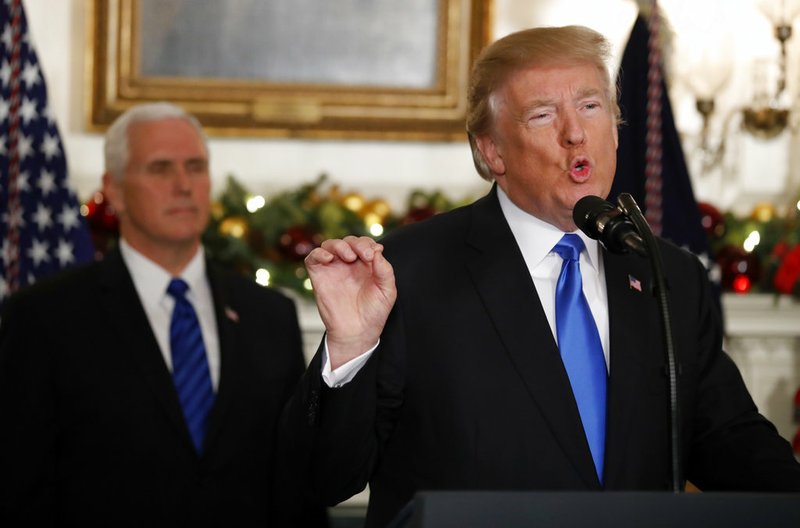 Associated Press/ALEX BRANDON President Donald Trump, accompanied by Vice President Mike Pence, speaks in the Diplomatic Reception Room of the White House, Wednesday, Dec. 6, 2017, in Washington. Trump recognized Jerusalem as Israel's capital despite intense Arab, Muslim and European opposition to a move that would upend decades of U.S. policy and risk potentially violent protests.