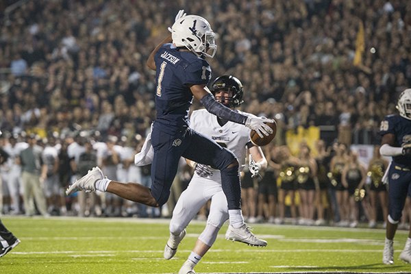 Bentonville West receiver Jadon Jackson (1) scores a touchdown during the second quarter of a game against Bentonville on Friday, Nov. 3, 2017, in Bentonville. 