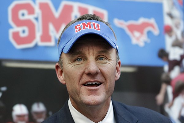 New SMU head football coach Chad Morris speaks after being introduced during a news conference at SMU, Monday, Dec. 1, 2014, in Dallas. The former Clemson offensive coordinator replaces June Jones and is also a former Texas high school football coach. (AP Photo/LM Otero)
