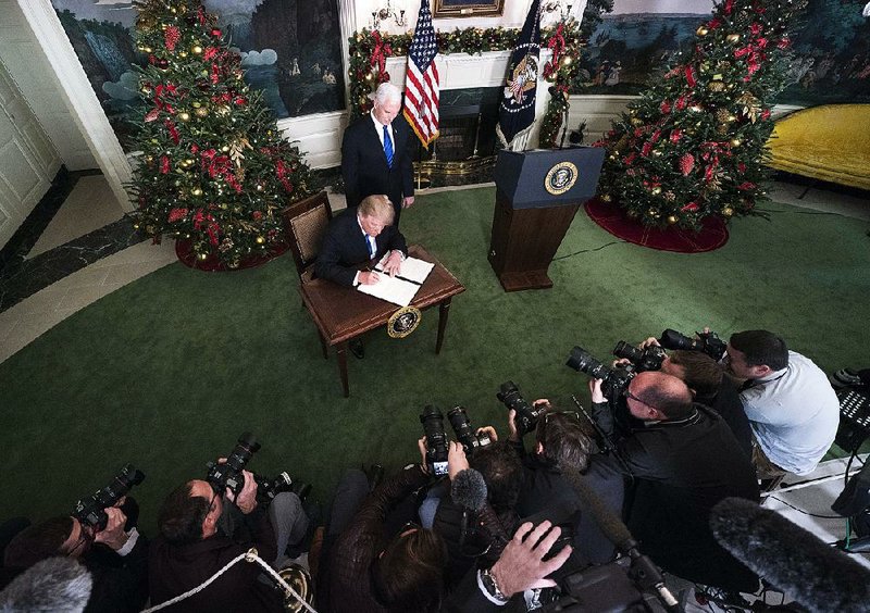 Calling it “a long overdue step to advance the peace process,” President Donald Trump signs a proclamation recognizing Jerusalem as the capital of Israel in a ceremony Wednesday at the White House. 
