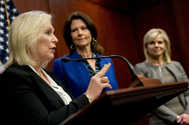 Sen. Kirsten Gillibrand (left), D-N.Y.,speaks at a news conference on Capitol Hill on Wednesday, where she and other members of Congress introduced legislation to curb sexual harassment in the workplace.  