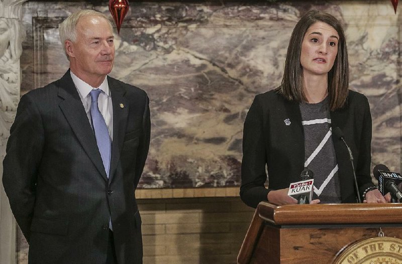 Mary Condit, director of the Arkansas Coding Academy, discusses the creation of a program introduced Wednesday at the Capitol that offers scholarships to the coding academy. Gov. Asa Hutchinson (left) gave an update on the state’s progress in coding classes.