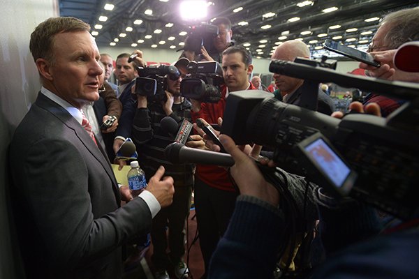 Newly hired University of Arkansas football coach Chad Morris speaks Thursday, Dec. 7, 2017, to members of the media after a press conference at the Fowler Family Baseball and Track Indoor Training Center in Fayetteville.