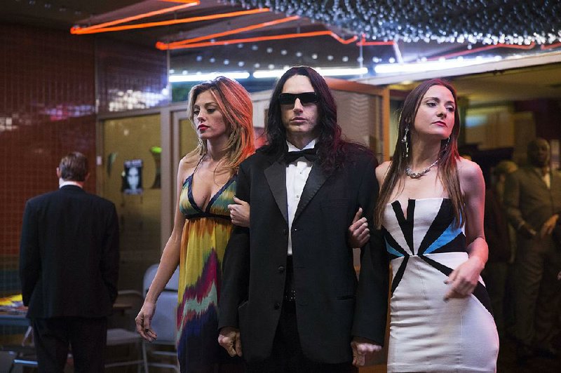 Mysterious auteur Tommy Wiseau (James Franco) is flanked by admirers in The Disaster Artist, a making-of story of one of the world’s strangest movies.