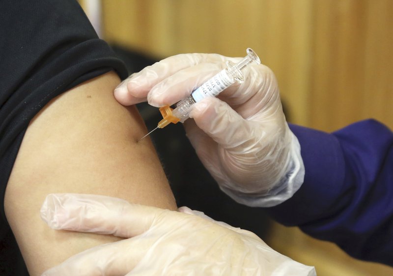 Miguel Roberts/The Brownsville Herald via AP In this Friday, Sept. 22, 2017 file photo, a flu vaccine injection is administered at the Brownsville Events Center by a pharmacist in Brownsville, Texas. According to data released by the Centers for Disease Control and Prevention on Friday, Dec. 8, 2017, this year's flu season is off to a quick start and so far it seems to be dominated by a nasty bug.