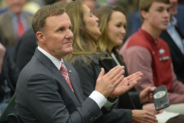 Newly hired University of Arkansas football coach Chad Morris listens Thursday, Dec. 7, 2017, during a press conference at the Fowler Family Baseball and Track Indoor Training Center in Fayetteville.
