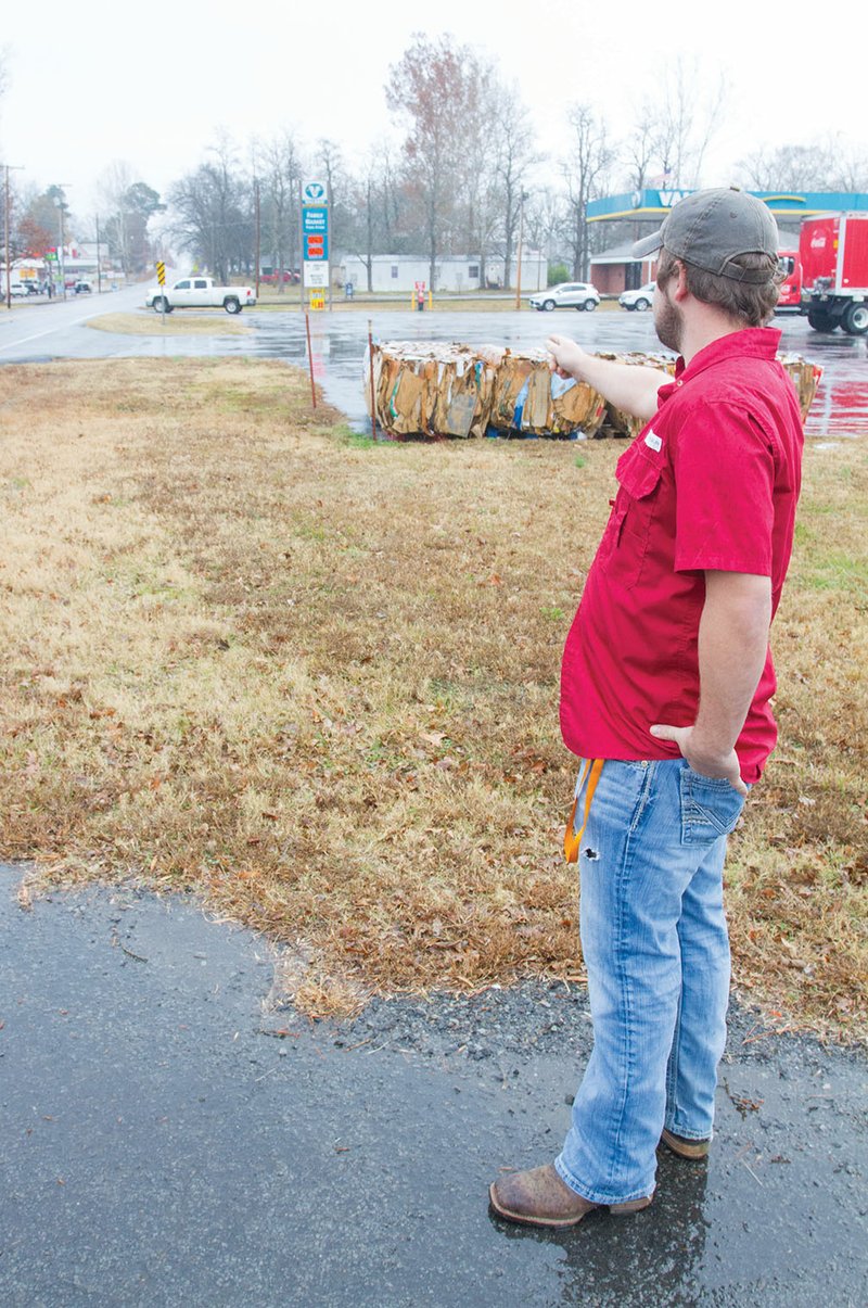 Pangburn Mayor David Wilson points down Main Street where sidewalks will be built near City Hall, connecting many of the downtown businesses in his city. Pangburn received a $100,000 matching grant for the project from the Arkansas Department of Transportation.