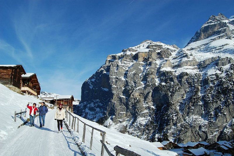 The Swiss village of Gimmelwald, under a blanket of snow, is a picturesque place for winter festivities.