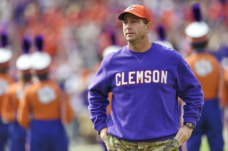 Clemson head coach Dabo Swinney watches before the start of an NCAA college football game against Citadel, Saturday, Nov. 18, 2017, in Clemson, S.C. 