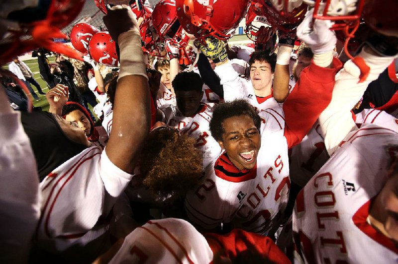 Rivercrest players celebrate after Friday night’s victory over Junction City in the Class 3A state championship game at War Memorial Stadium. It was Rivercrest’s third state title.