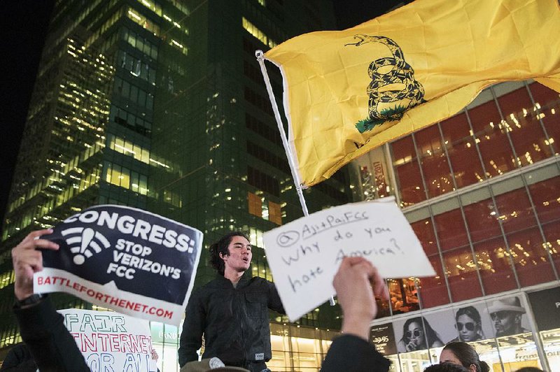 Supporters of Net neutrality hold a rally in New York City as protests sprang up Thursday outside Verizon stores across the country.