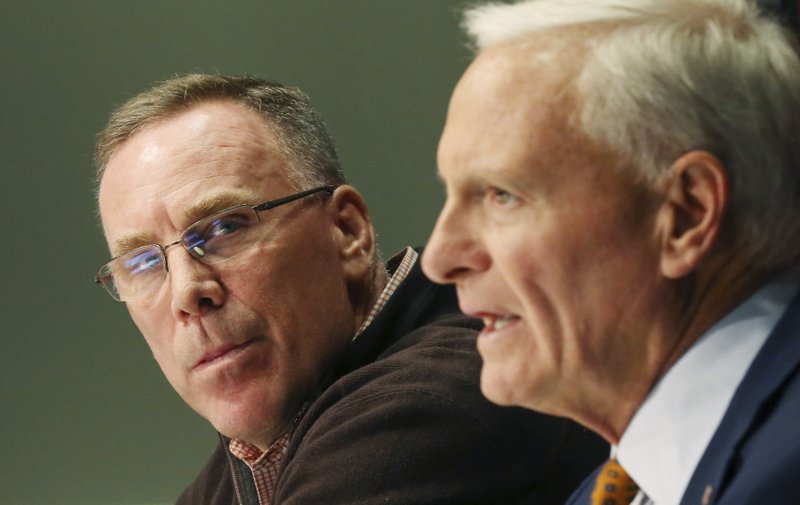 Cleveland Browns owner Jimmy Haslam, right, introduces the NFL football teams new general manager, John Dorsey, left, gestures during an introductory press conference in Berea, Ohio, Friday, Dec. 8, 2017. (John Kuntz/The Plain Dealer via AP)