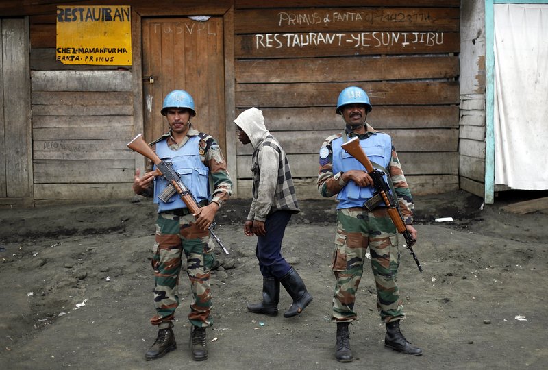 In this Friday Nov. 30, 2012 file photo, Two UN soldiers stand guard in Goma, Democratic Republic of Congo. 