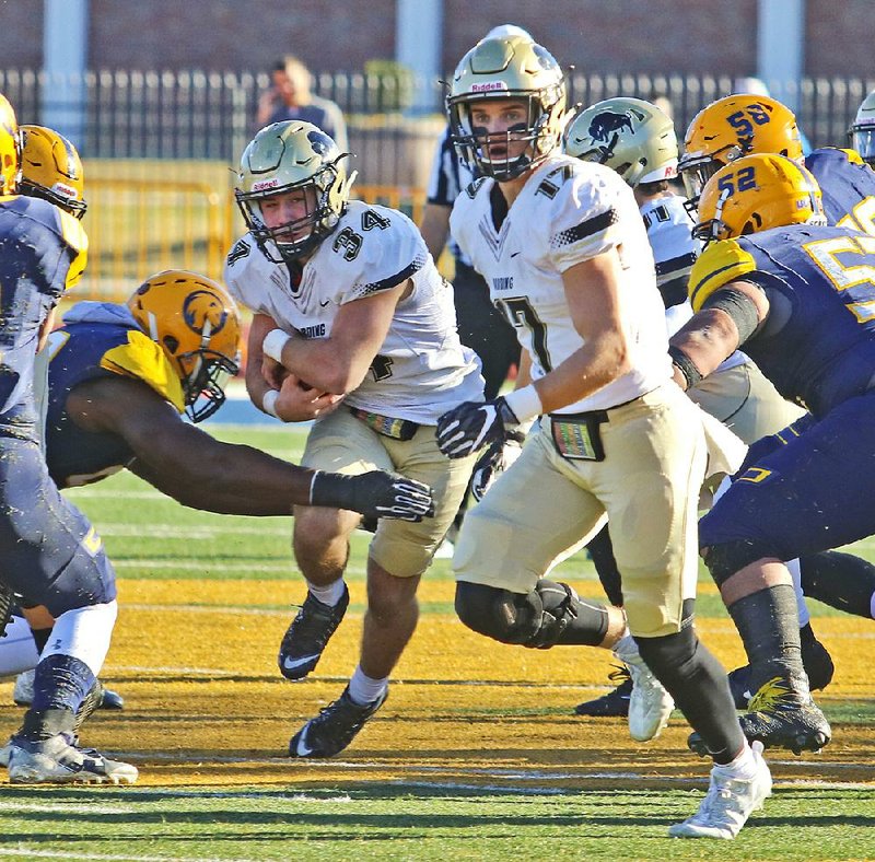 Harding’s Cole Chancey (34) ran for 98 yards and a fourth-quarter touchdown in the Bisons’ 31-17 loss to Texas A&M-Commerce on Saturday in the NCAA Division II semifinals at Memorial Stadium in Commerce, Texas.