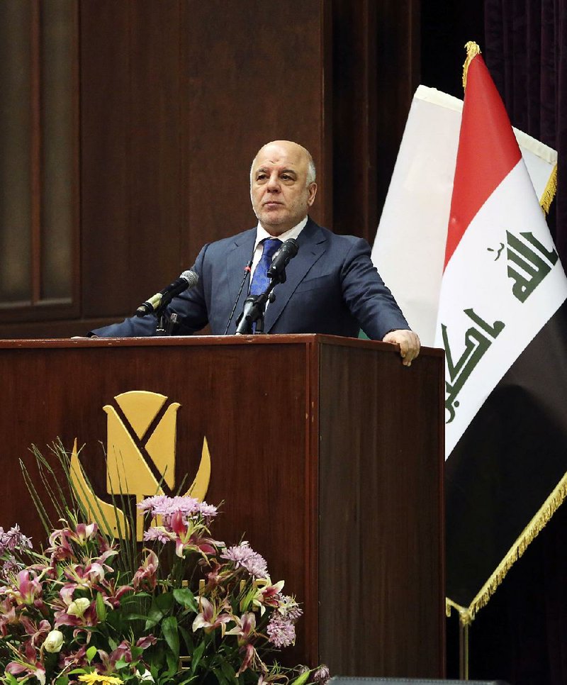 Iraq Prime Minister Haider al-Abadi gestures, during a press conference, in Baghdad, Iraq, Saturday, Dec. 9, 2017. 