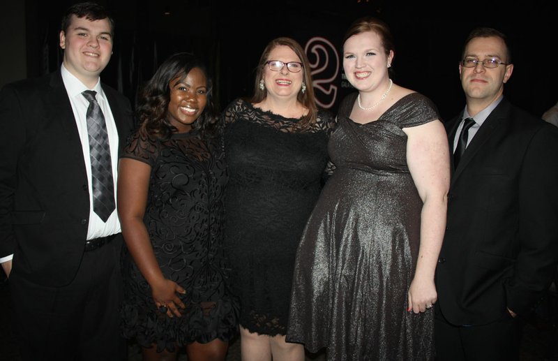 NWA Democrat-Gazette/CARIN SCHOPPMEYER Melinda Beith, Arts Educator Award honoree (center), is joined by Adam Beith (from left), Jada Brunson and Kelly and Adam Martin at the TheatreSquared Gala on Nov. 16 at the Fayetteville Town Center.