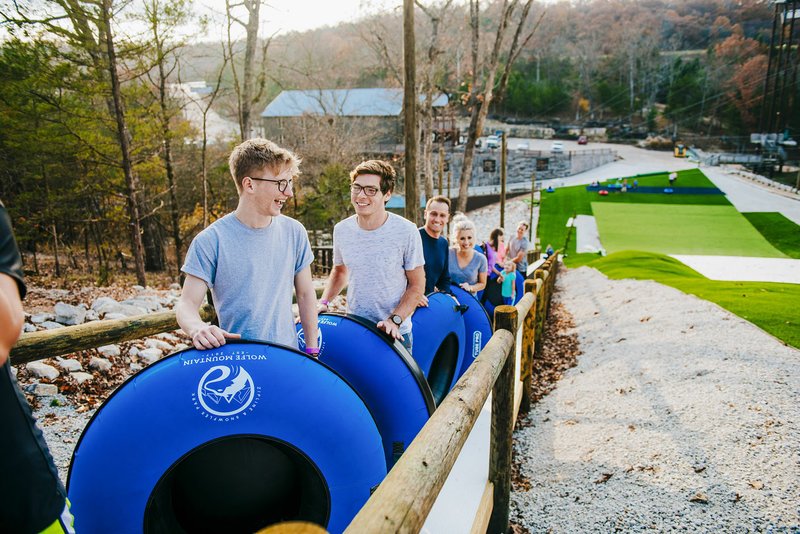 A “Magic Carpet” carries riders up the hill so they can tube down it at Snowflex.
