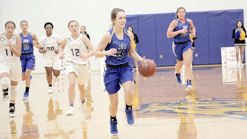 Photo submitted John Brown senior Jana Schammel leads the fast break Tuesday against Central Christian (Kan.) in McPherson, Kan.