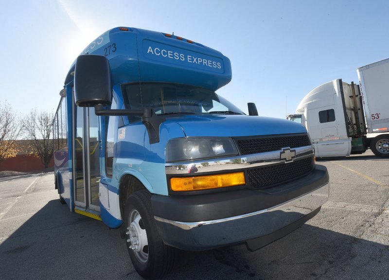 NWA Democrat-Gazette/FLIP PUTTHOFF
An Ozark Regional Transit bus waits Wednesday Nov. 22 2017 for passengers at a stop in Rogers.