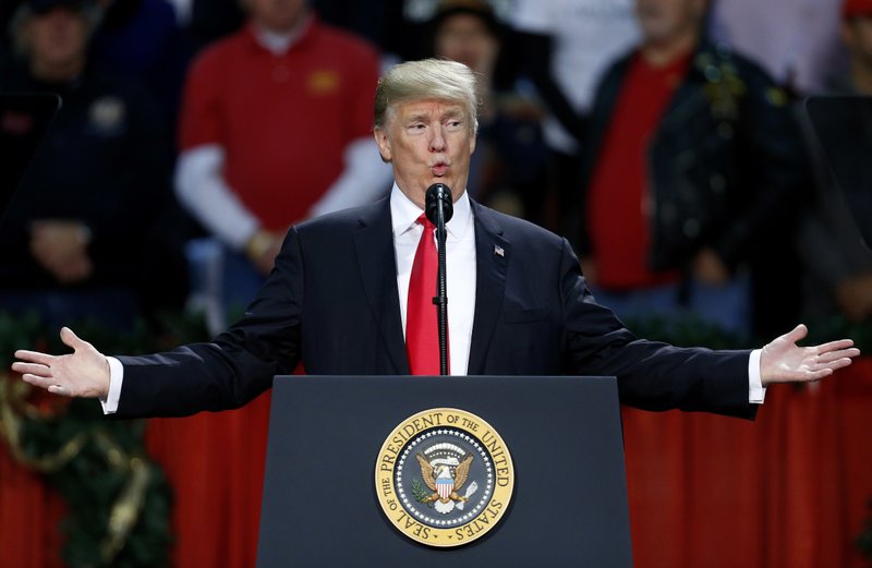 President Donald Trump speaks during a rally in Pensacola, Fla., Friday, Dec. 8, 2017. (AP Photo/Jonathan Bachman)