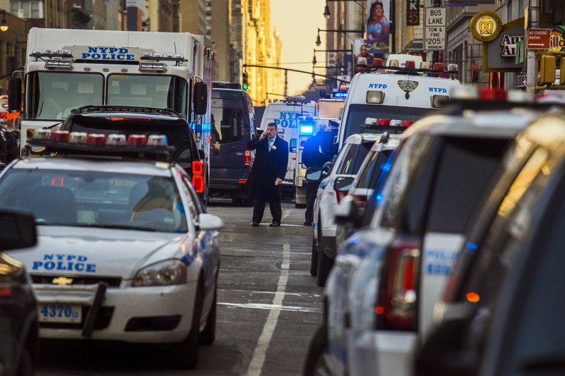 AP Photo/ANDRES KUDACKI Police block a street by Port Authority Bus Terminal near New York's Times Square following an explosion on Monday, Dec. 11, 2017. Police say the explosion happened in an underground passageway under 42nd Street between Seventh and Eighth Avenues.