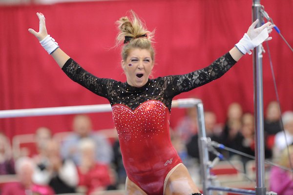 Arkansas’ Braie Speed celebrates Friday, March 11, 2016, after competing in the bars rotation during the 11th-ranked Razorbacks’ meet with Utah State in Barnhill Arena in Fayetteville.