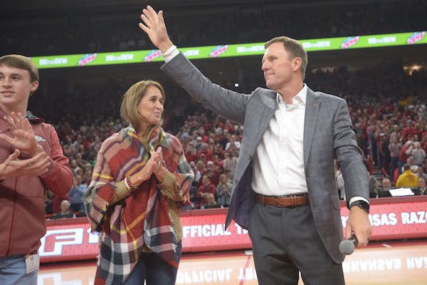 New Arkansas football coach Chad Morris waves to the crowd after being introduced in the first half of the Razorbacks' basketball game against Minnesota Saturday, Dec. 9, 2017, in Bud Walton Arena. 