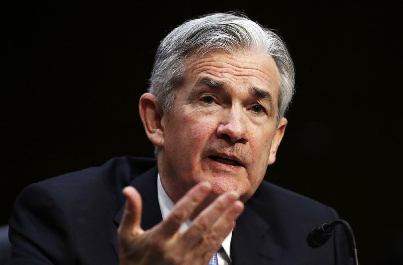 In this Tuesday, Nov. 28, 2017, photo, Jerome Powell, President Donald Trump's nominee for chairman of the Federal Reserve, testifies during his confirmation hearing before the Senate Banking, Housing, and Urban Affairs Committee on Capitol Hill in Washington. On Tuesday, Dec. 5, 2017, the Senate Banking Committee approved Powell to be the next chairman of the Federal Reserve. 