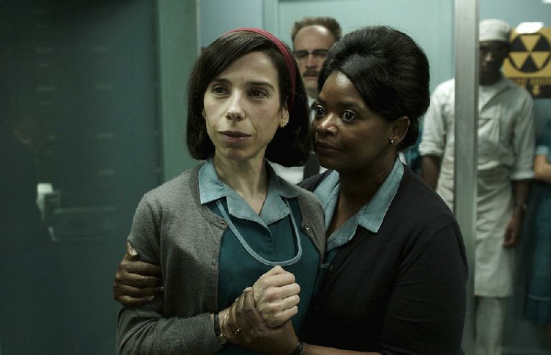 This image released by Fox Searchlight Pictures shows Sally Hawkins (left) and Octavia Spencer in a scene from the film The Shape of Water.