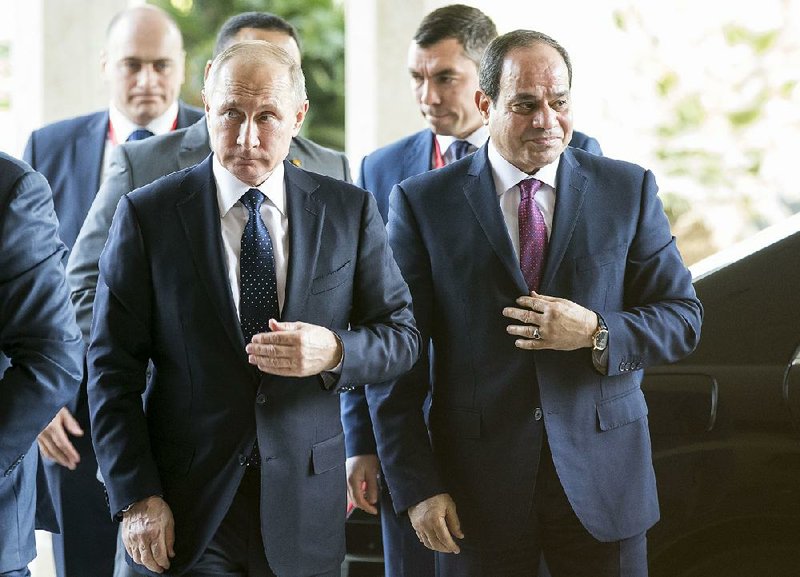Russian President Vladimir Putin (left), with Egyptian President Abdel-Fattah el-Sissi, arrives Monday for talks in Cairo, where they finalized a deal to build a $30 billion nuclear plant in the North African country. 