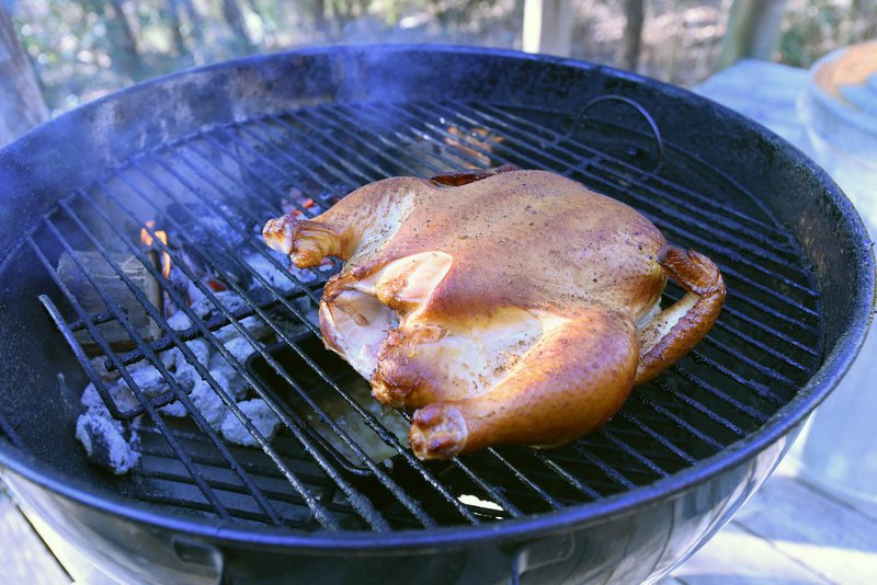 This chicken is nearly done, smoked Thursday on a kettle-style grill for hours without ever adding charcoal or opening the lid. A turkey will be smoked on Christmas Day.