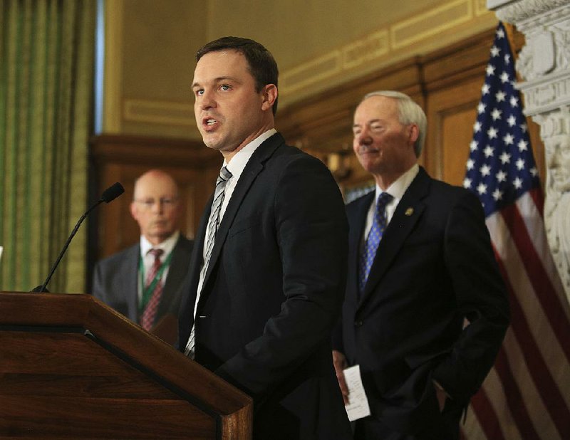  Jared Henderson, then the executive director of Teach for America in Arkansas, (center) is shown with Gov. Asa Hutchinson (right) and Little Rock School District Superintendent Baker Kurrus in this file photo.