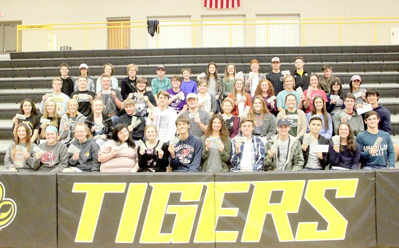 LYNN KUTTER ENTERPRISE-LEADER Prairie Grove High School recently held its annual celebration to hand out $100 bills to students who passed Advanced Placement tests last spring. Principal Ron Bond said 94 students received a total of $14,400, with passing scores on 144 exams. Students received $100 for each passing score. Bond commended students for &quot;choosing a higher academic rigor&quot; and encouraged them to continue to work hard. The group photo does not include students who graduated in May.