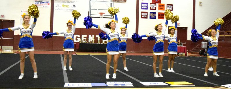 Westside Eagle Observer/MIKE ECKELS The Decatur Cheer team leads a game day cheer during the 2017 Gentry Cheer Classic at Pioneer Gym in Gentry Dec. 4. Members of the team include Alexis Patterson (left), Kaitlyn Smith, Jasmine Godines, Tabitha Tilley, Desi Meek, Heidi Rubi and Emme Lee.